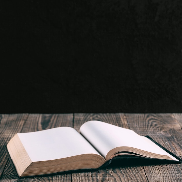 Books on the background of wood