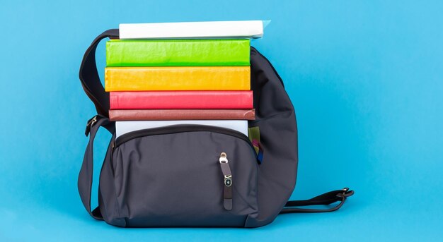 Photo books on a black school bag