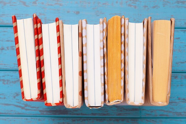 books on blue wooden table