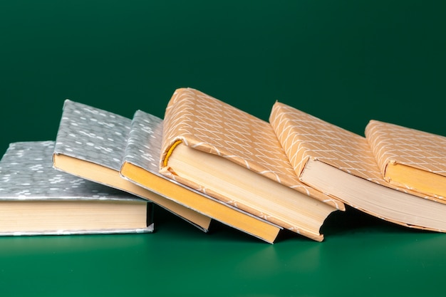 Books isolated on green 