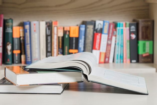 Books lying near bookshelf