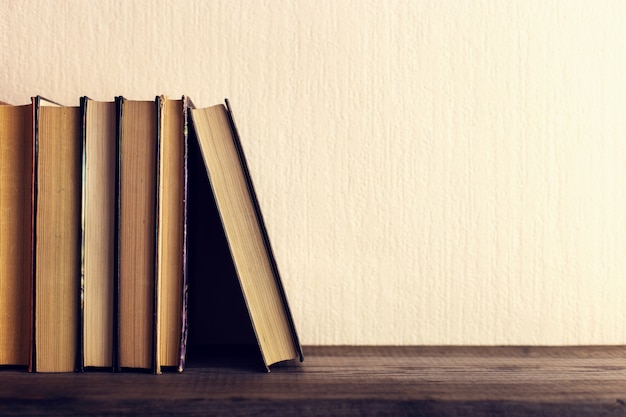 Books on the old wooden shelf. 