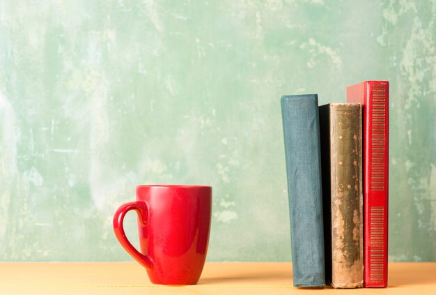 Books and a red cup