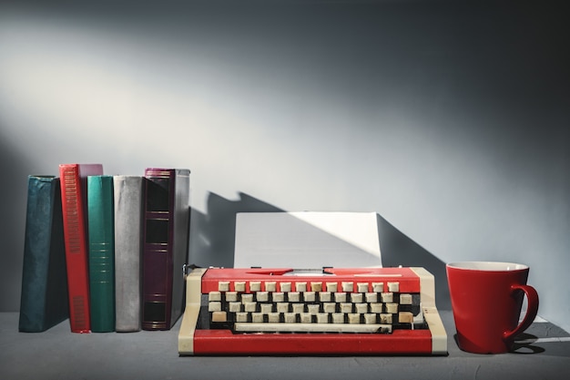 Books, a typewriter and a mug of tea.