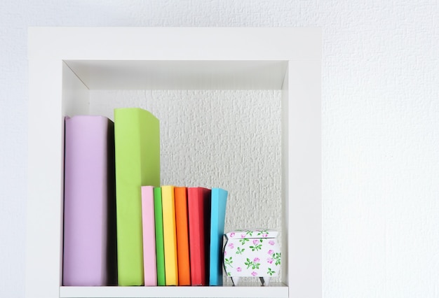 Books on white shelf