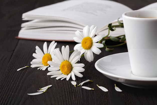 Books with bouquet of flowers