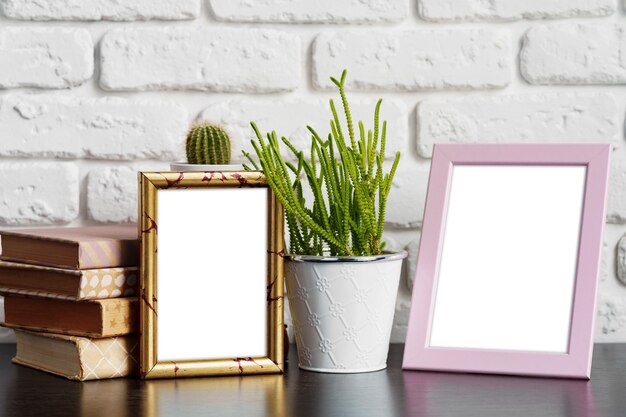 Books with picture frame on wooden table