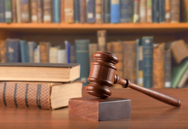 Books and wooden gavel, close-up view