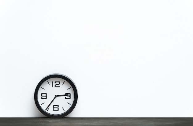 Bookshelf with clock isolated on white