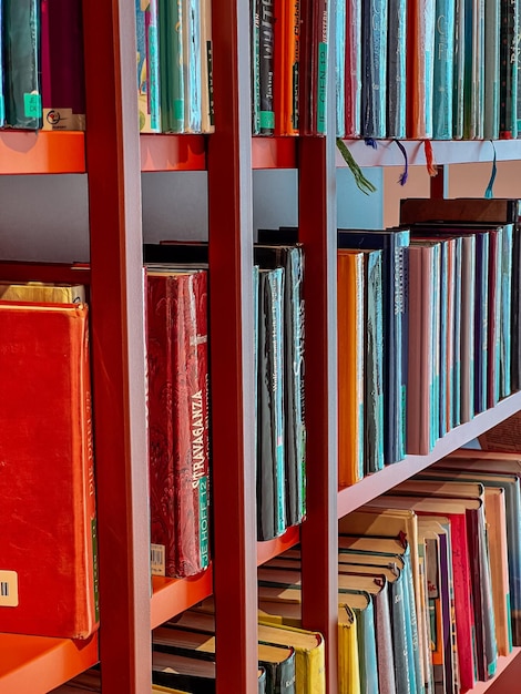 Photo bookshelves with various books in the city library