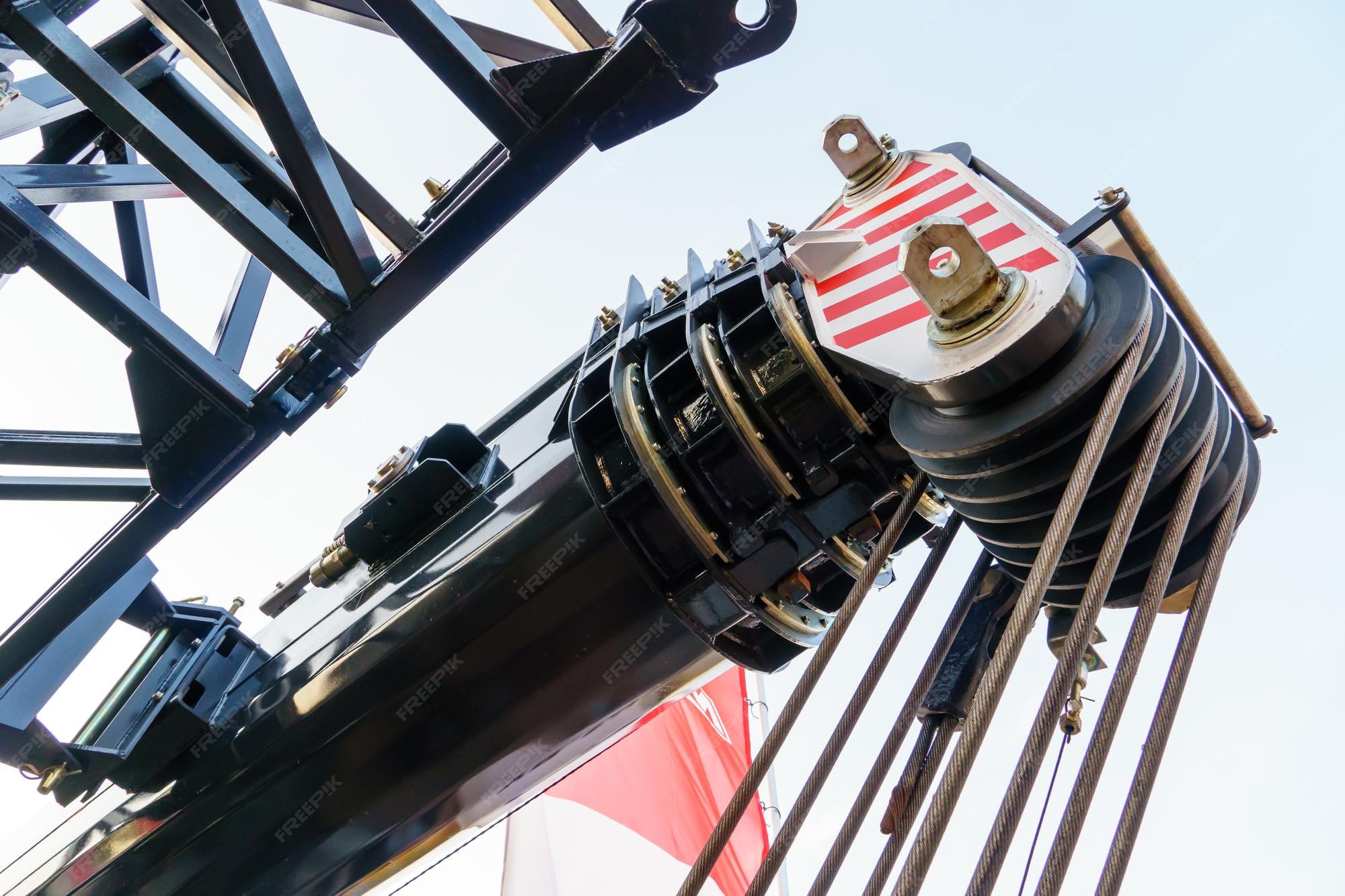 Premium Photo | The boom of a wheeled crane and a rope for lifting