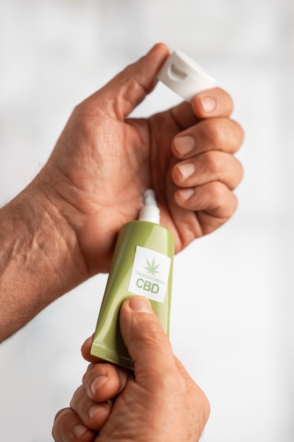 Photo boomers using cbd oil and cream for treating body pain