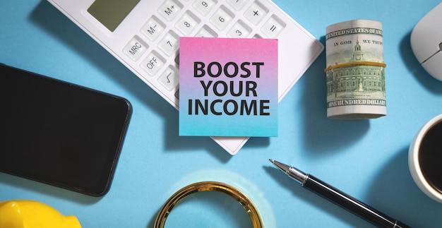 Boost Your Income text on sticky note with a business objects