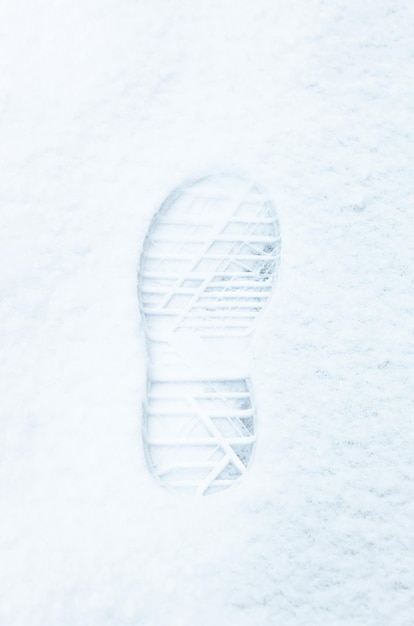 Photo boot footprint in snow close-up