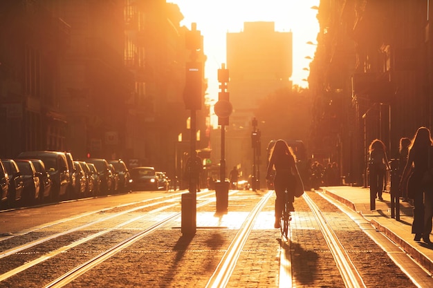 Bordeaux France September 18 2020 woman riding bicycle during the sunset in the city of Bordeaux in vintage style