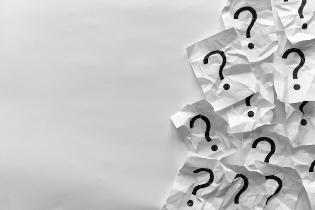 Photo border of crumpled question marks on cards