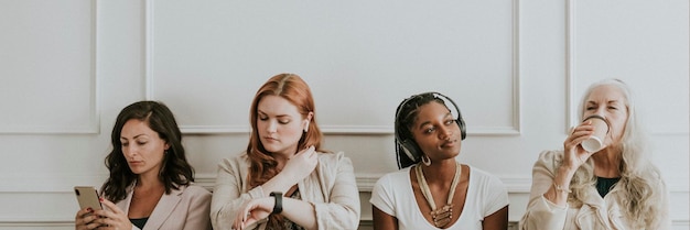 Bored businesswomen using digital devices