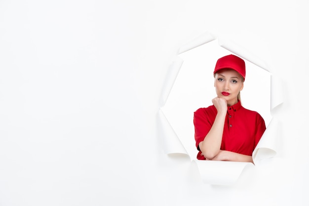 Bored female worker in red uniform on white