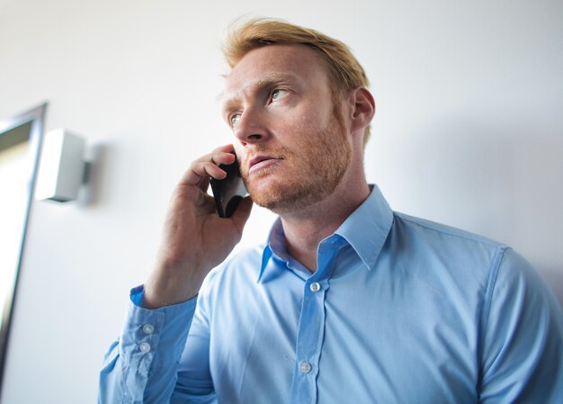 Bored man at telephone