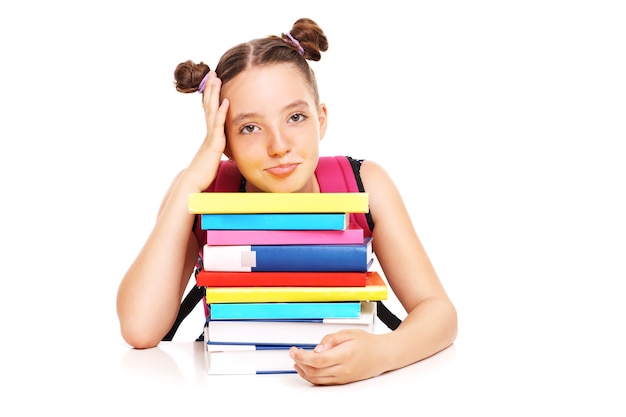 a bored schoolgirl posing over white background