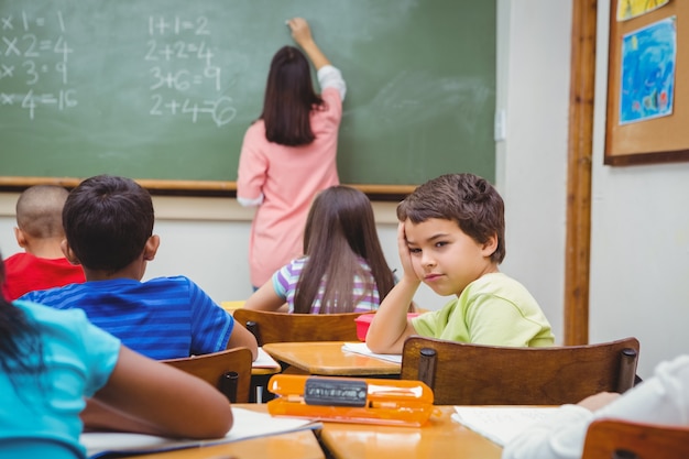 Bored student looking away from board