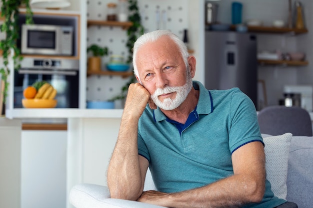 Bored tired sad mature man depressed lonely having no visitors of his children Divorce bachelor health problems concept Lockdown unemployment needless man on social distance