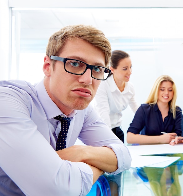 Bored young executive gesture multi ethnic meeting