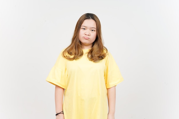 Boring gesture of Beautiful Asian Woman wearing yellow TShirt Isolated On White Background