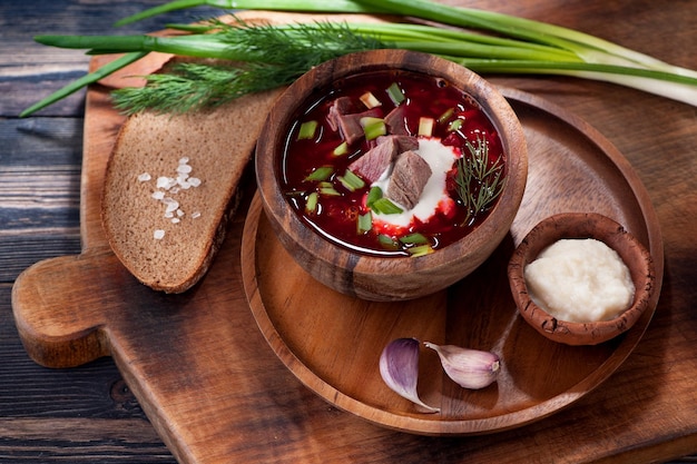 Borsch on the old wooden board