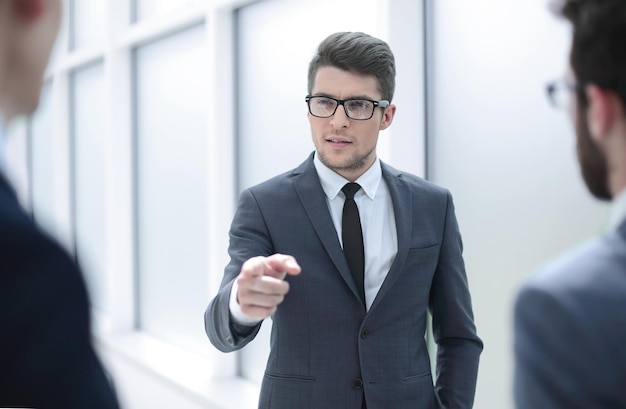 Boss is discussing something with his employees business concept