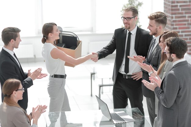 Boss and the new employee shaking hands with each other