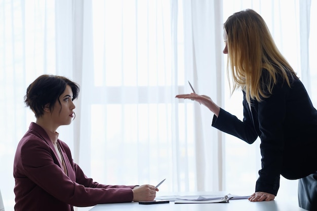 Boss reproaching her employee business woman getting a reprimand or reproof chief manager superior and subordinate professional relationship