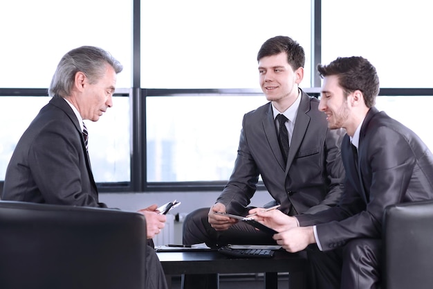 Boss with a clipboard sitting in an office photo with copy space