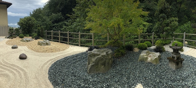 Botanical garden with japanese stones near varone waterfalls in italy