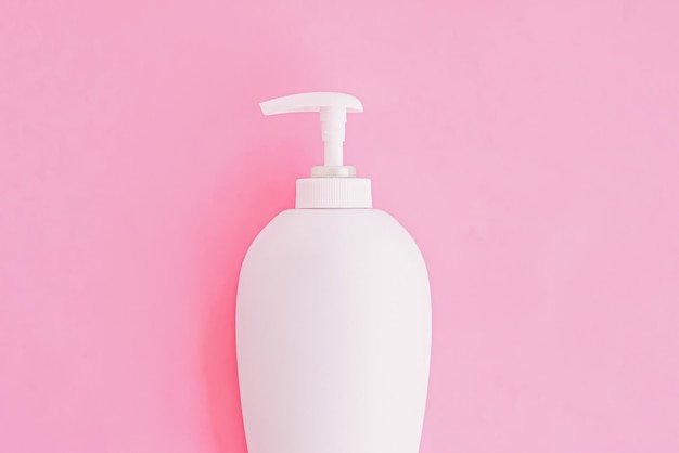 Bottle of antibacterial liquid soap and hand sanitizer on pink background hygiene product and healthcare