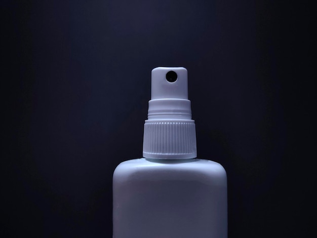 Bottle of antiseptic on a black background