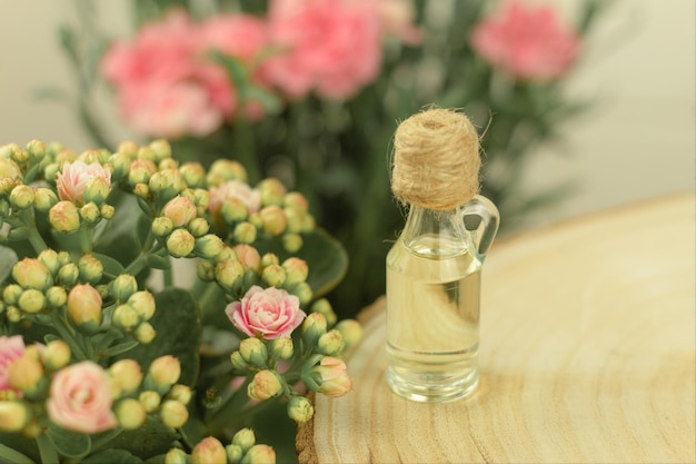 A bottle of aromatic oil made from fresh flower petals