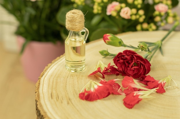 A bottle of aromatic oil made from fresh flower petals