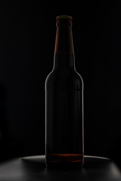 A bottle of beer on a black background