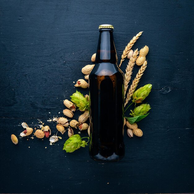 A bottle of beer hops and grain Top view Free space for text