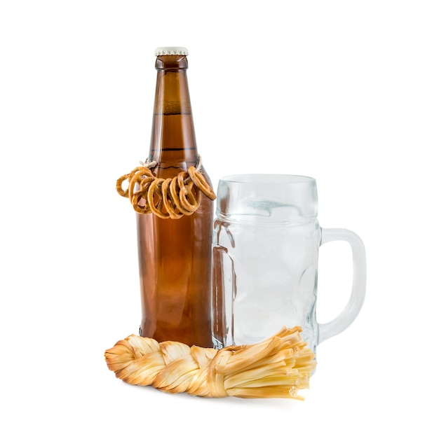 Bottle of beer with empty glass and salty smoked cheese on white background