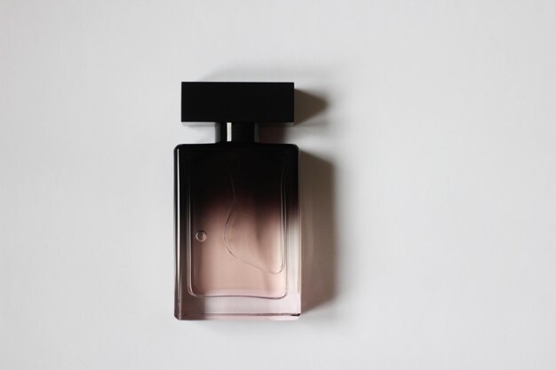 A bottle of black perfume in closeup on a white isolated background