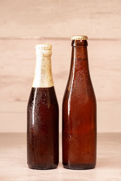 A bottle of blond beer and a bottle of amber beer