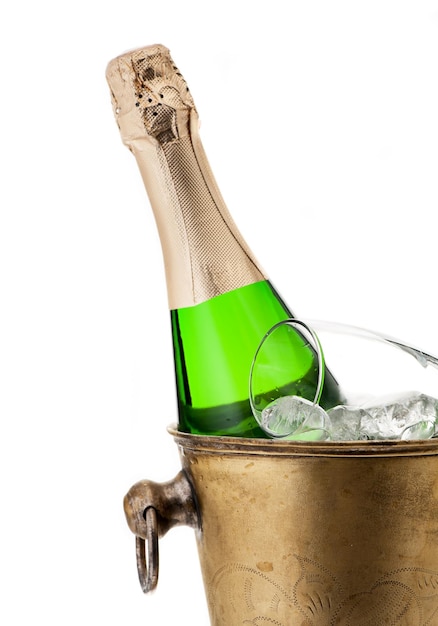 Bottle of champagne in bucket on a white background