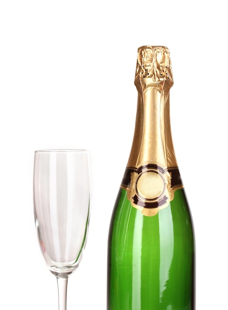 Bottle of champagne and goblet isolated on white