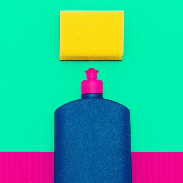 Photo bottle of cleaning agent and a sponge. minimal art