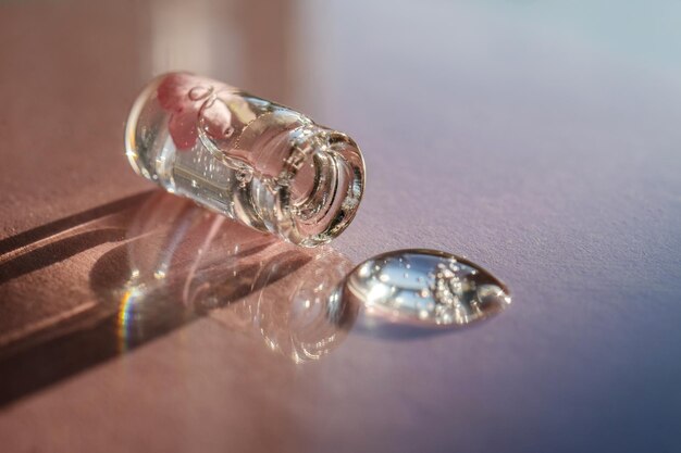 Photo a bottle of cosmetic gel on a pink background