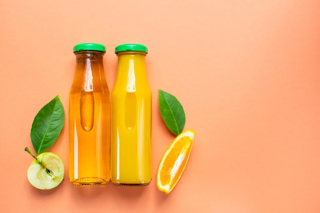 bottle of fresh orange juice apple juice Flat lay Copy space top view