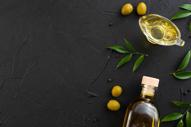 Premium Photo | Bottle and glass of olive oil with copy space