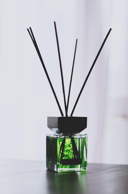 Bottle of green home perfume